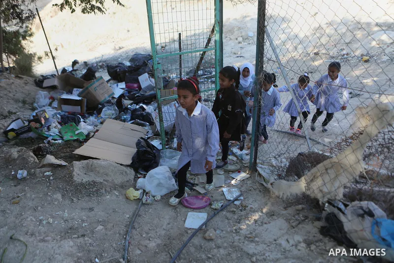 Palestinian schoolchildren return back to their school in the morning of the first day of the new year study, at Khan al-Ahmar's school at the Palestinian Bedouin village of Khan al-Ahmar, east of Jerusalem in the occupi...