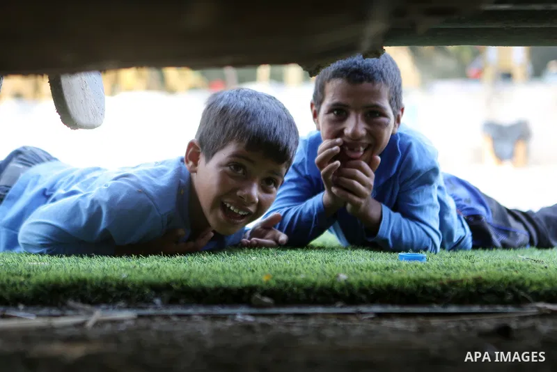 Palestinian schoolchildren return back to their school in the morning of the first day of the new year study, at Khan al-Ahmar's school at the Palestinian Bedouin village of Khan al-Ahmar, east of Jerusalem in the occupi...