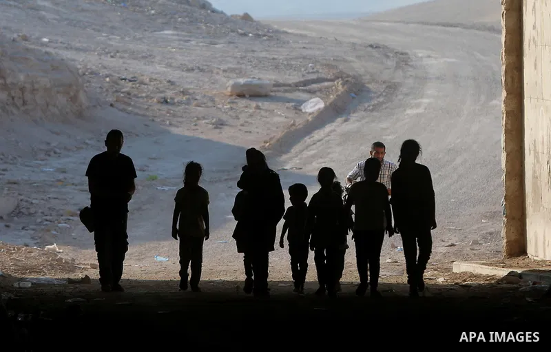 Palestinian schoolchildren return back to their school in the morning of the first day of the new year study, at Khan al-Ahmar's school at the Palestinian Bedouin village of Khan al-Ahmar, east of Jerusalem in the occupi...