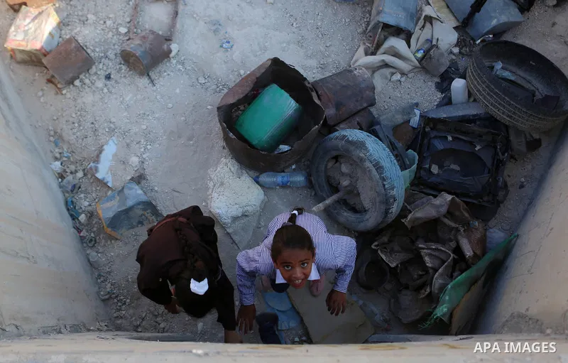 Palestinian schoolchildren return back to their school in the morning of the first day of the new year study, at Khan al-Ahmar's school at the Palestinian Bedouin village of Khan al-Ahmar, east of Jerusalem in the occupi...