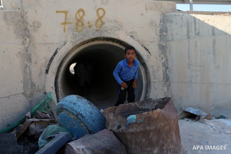 Palestinian schoolchildren return back to their school in the morning of the first day of the new year study, at Khan al-Ahmar's school at the Palestinian Bedouin village of Khan al-Ahmar, east of Jerusalem in the occupi...