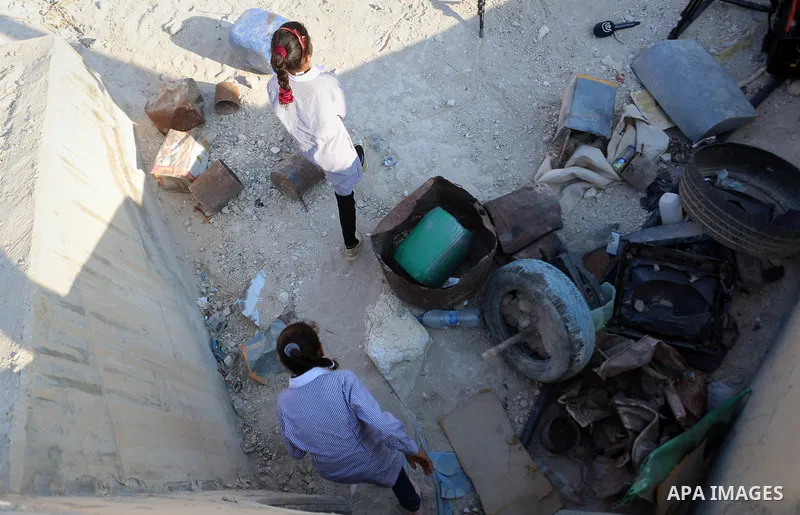 Palestinian schoolchildren return back to their school in the morning of the first day of the new year study, at Khan al-Ahmar's school at the Palestinian Bedouin village of Khan al-Ahmar, east of Jerusalem in the occupi...