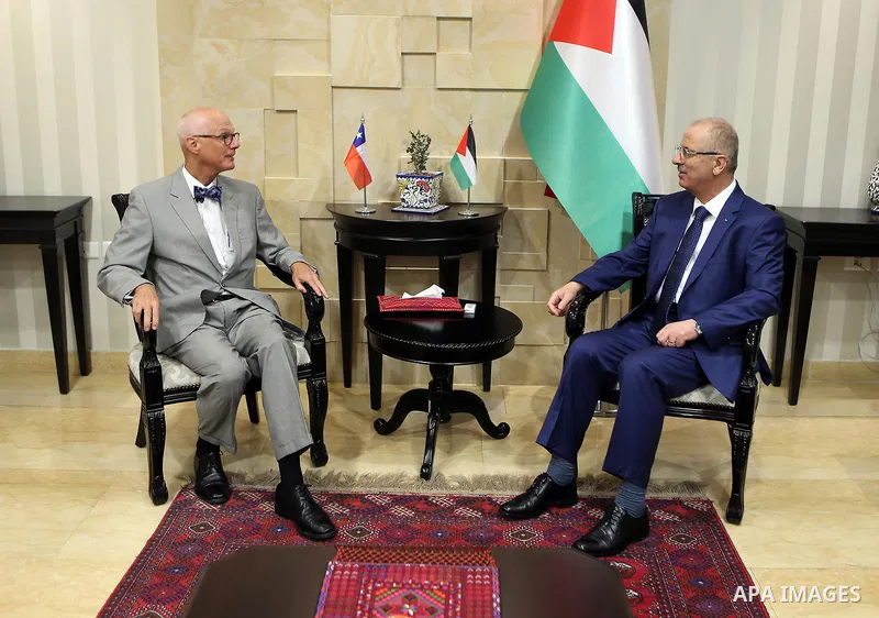 Palestinian Prime Minister, Rami Hamdallah, meets with Chilean Ambassador to the State of Palestine, Francisco Bernales in the West Bank city of Ramallah, on July 16, 2018. Photo by Prime Minister Office
