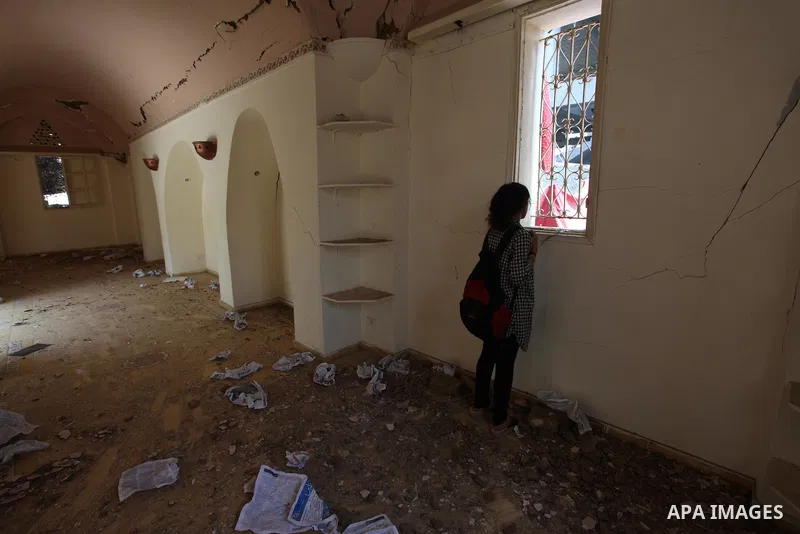 Palestinian artists take part in an exhibition against the bombing of the Arts and Crafts Village that was damaged in an Israeli airstrike on the Gaza City, on July 16, 2018. Photo by Mahmoud Ajour