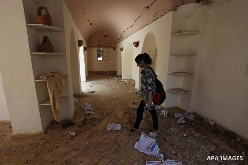 Palestinian artists take part in an exhibition against the bombing of the Arts and Crafts Village that was damaged in an Israeli airstrike on the Gaza City, on July 16, 2018. Photo by Mahmoud Ajour