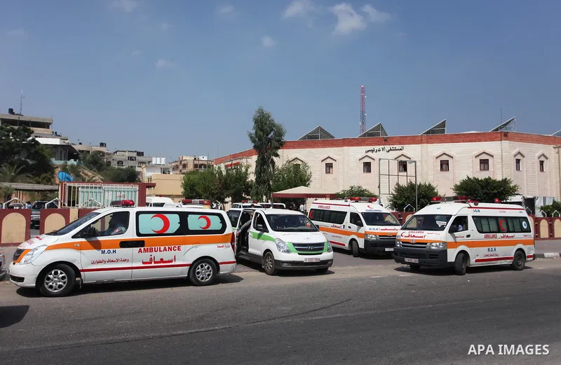 Palestinian ambulance drivers take part in a protest against the siege on the Gaza Strip, outside Indonesian hospital, in the northern of Gaza Strip on July 17, 2018. Photo by Mahmoud Ajour
