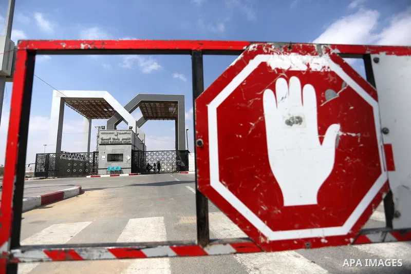 Palestinian security forces loyal to the Palestinian Authority stand at the Rafah border crossing with Egypt in the southern Gaza Strip on July 17, 2018. Israel further tightened its blockade of the Gaza Strip preventing...