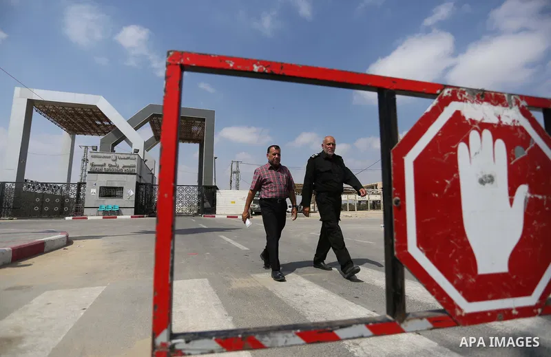 Palestinian security forces loyal to the Palestinian Authority stand at the Rafah border crossing with Egypt in the southern Gaza Strip on July 17, 2018. Israel further tightened its blockade of the Gaza Strip preventing...