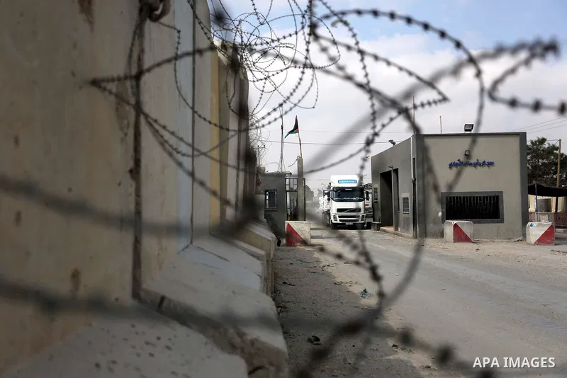 A truck is seen at the gate of the Kerem Shalom crossing, the main passage point for goods entering Gaza, in the southern Gaza Strip town of Rafah, on July 17, 2018. Israel further tightened its blockade of the Gaza Stri...