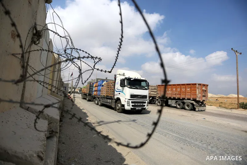 A truck is seen at the gate of the Kerem Shalom crossing, the main passage point for goods entering Gaza, in the southern Gaza Strip town of Rafah, on July 17, 2018. Israel further tightened its blockade of the Gaza Stri...