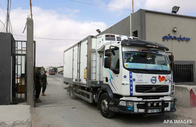 A truck is seen at the gate of the Kerem Shalom crossing, the main passage point for goods entering Gaza, in the southern Gaza Strip town of Rafah, on July 17, 2018. Israel further tightened its blockade of the Gaza Stri...