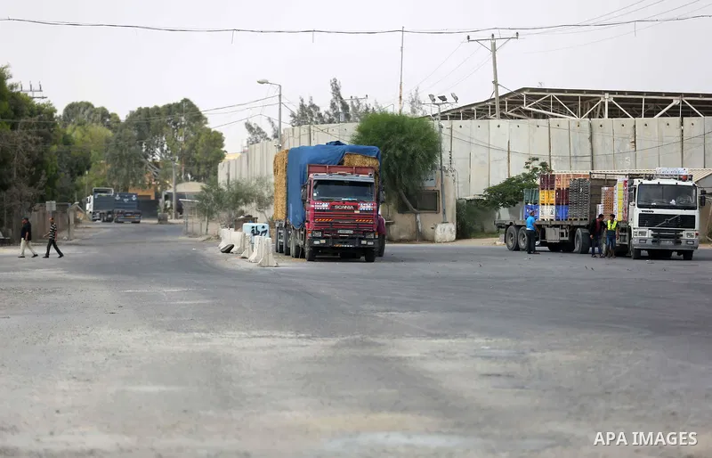A truck is seen at the gate of the Kerem Shalom crossing, the main passage point for goods entering Gaza, in the southern Gaza Strip town of Rafah, on July 17, 2018. Israel further tightened its blockade of the Gaza Stri...