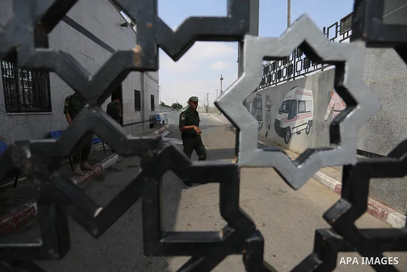 Palestinian security forces loyal to the Palestinian Authority stand at the Rafah border crossing with Egypt in the southern Gaza Strip on July 17, 2018. Israel further tightened its blockade of the Gaza Strip preventing...