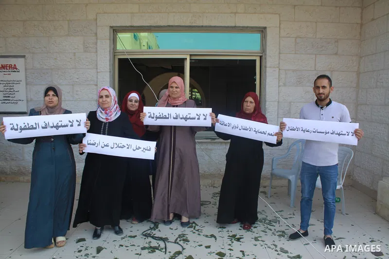 Palestinians take part in a protest against the killing of Palestinian children, in Gaza City, on July 17, 2018. Photo by Bashar Zakri