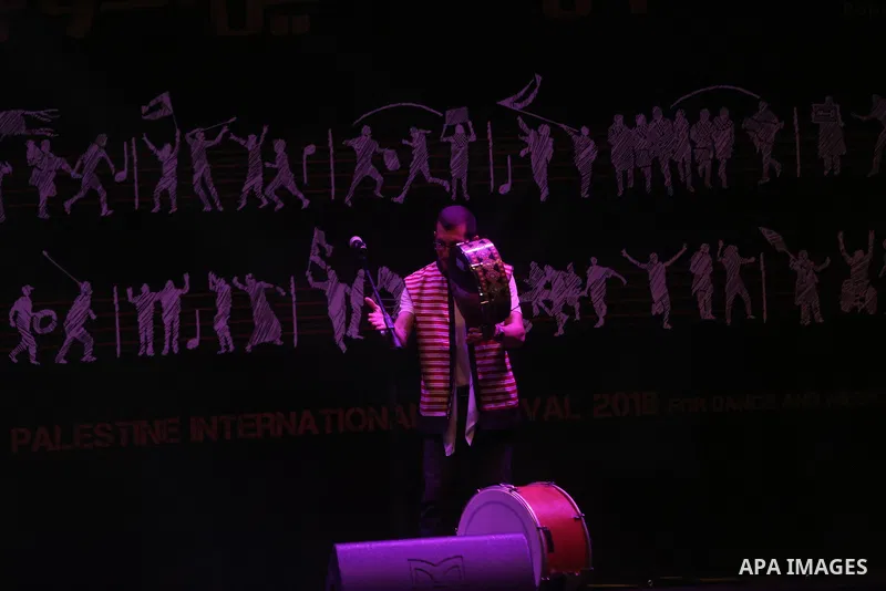 Palestinians attend the Palestine International Festival 2018, in the West Bank city of Ramallah, on July 17, 2018. Photo by Shadi Hatem