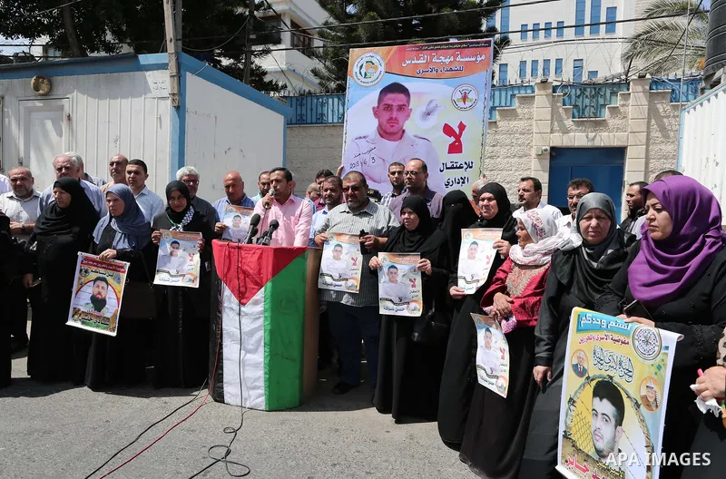 Palestinians take part in a protest to show solidarity with Hassan al-Shobaki who is in hunger strike at Israeli jails, in front of the high commissioner for human rights headquarters, in Gaza city, on July 19, 2018. Pho...