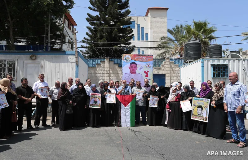 Palestinians take part in a protest to show solidarity with Hassan al-Shobaki who is in hunger strike at Israeli jails, in front of the high commissioner for human rights headquarters, in Gaza city, on July 19, 2018. Pho...
