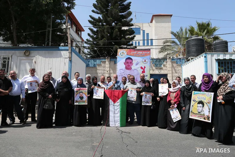 Palestinians take part in a protest to show solidarity with Hassan al-Shobaki who is in hunger strike at Israeli jails, in front of the high commissioner for human rights headquarters, in Gaza city, on July 19, 2018. Pho...