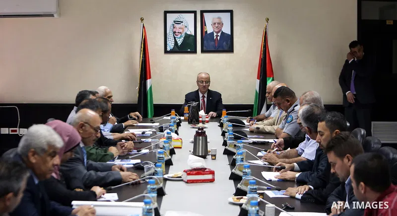 Palestinian Prime Minister Rami Hamdallah chairs a meeting of the Supreme Council of Civil Defense in the West Bank city of Ramallah on July 19, 2018. Photo by Prime Minister Office