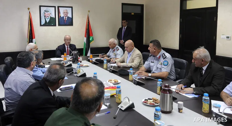 Palestinian Prime Minister Rami Hamdallah chairs a meeting of the Supreme Council of Civil Defense in the West Bank city of Ramallah on July 19, 2018. Photo by Prime Minister Office