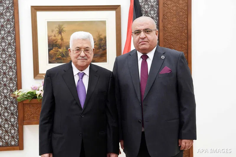 Abu Shehadeh sworn in as Deputy Governor of the Monetary Authority in front of Palestinian President Mahmoud Abbas in the West Bank city of Ramallah, on July 19, 2018. Photo by Thaer Ganaim