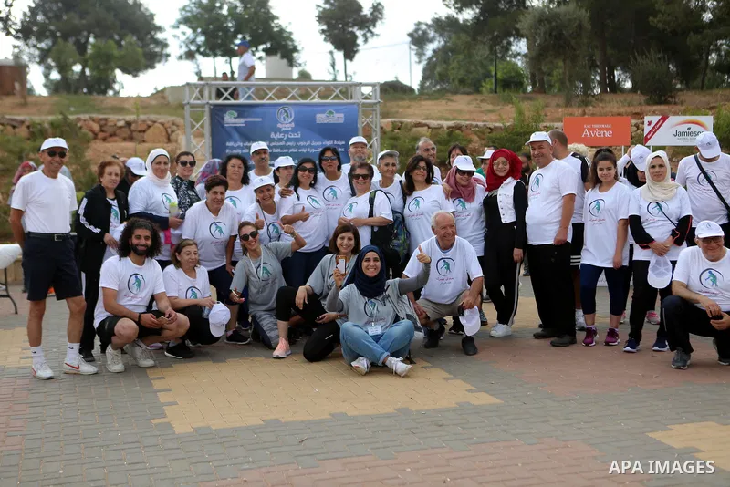 Palestinians take part in the challenge of walking, under the title: "Challenge your age" in the West Bank city of Ramallah, on July 20, 2018. Photo by Shadi Hatem