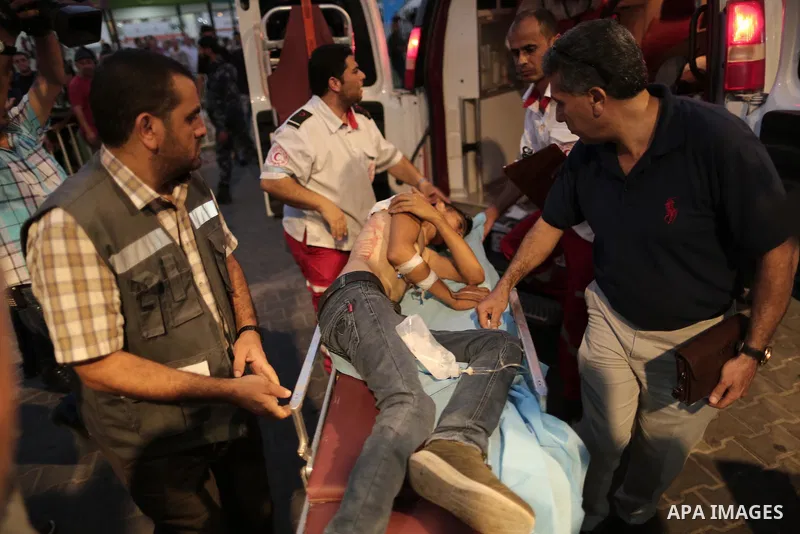 A Palestinian man who was wounded by Israeli troops during clashes at the Israel-Gaza border, in a tent city protest where Palestinians demand the right to return to their homeland, receives treatment at al-Shifa hospita...