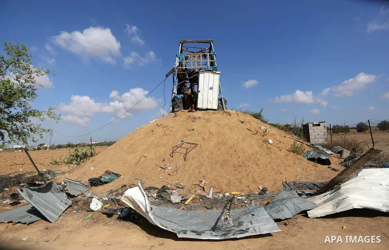 Palestinians inspect a military observation post damaged in an Israeli airstrike in Khan Younis in the southern of Gaza Strip, on July 21, 2018. Photo by Ashraf Amra