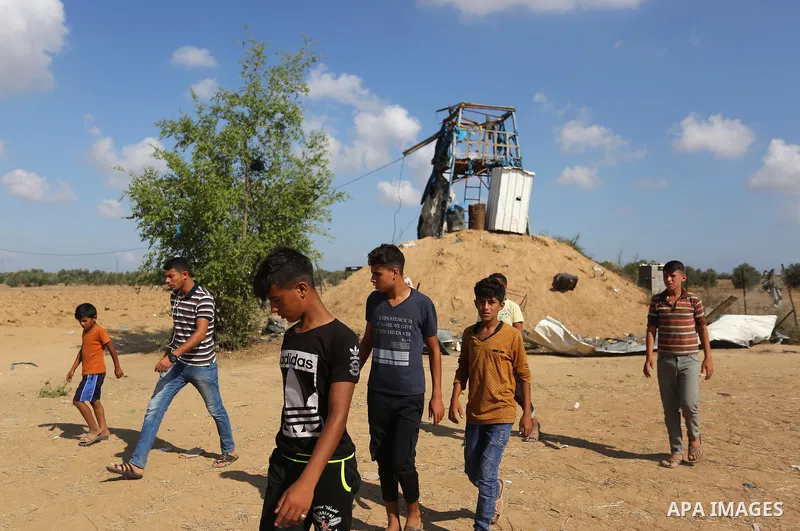 Palestinians inspect a military observation post damaged in an Israeli airstrike in Khan Younis in the southern of Gaza Strip, on July 21, 2018. Photo by Ashraf Amra