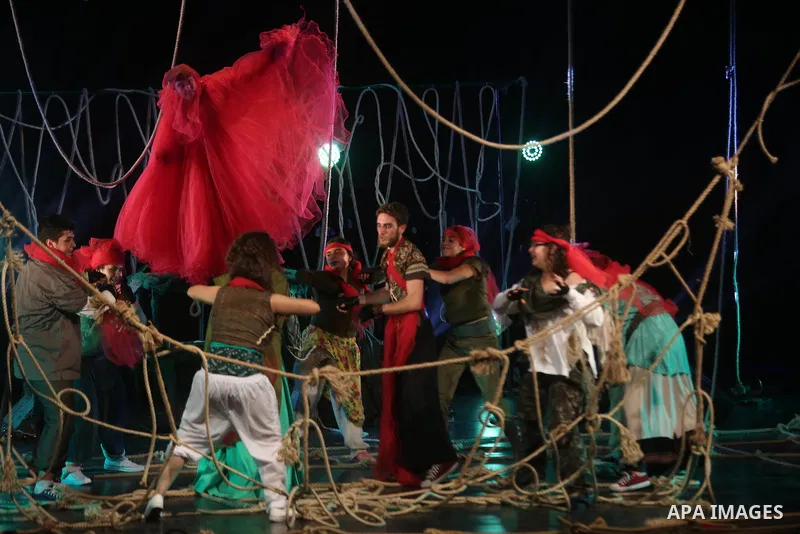 Palestinian actors perform in a play on a stage during the opening of the fourth Ishtar International Festival in the West Bank city of Ramallah, on July 21, 2018. Photo by Shadi Hatem