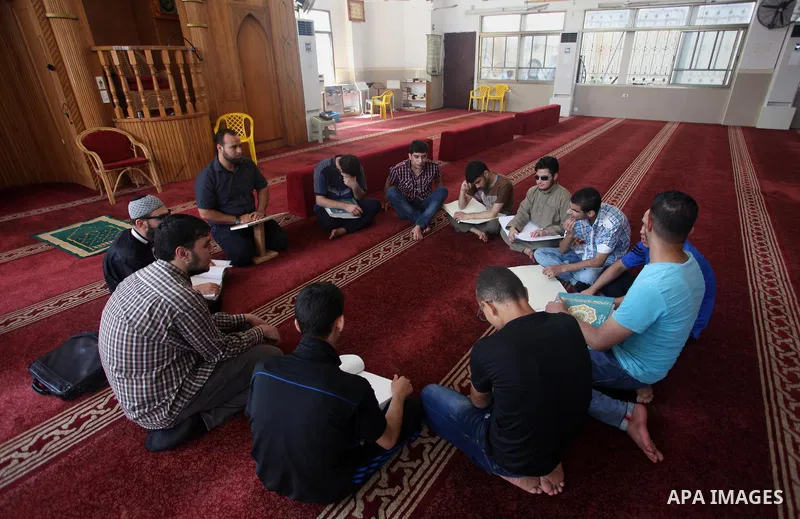 Palestinian blind boys read and memorise the holy Quran in braille at Dar al-Quran and Sunnah in Gaza city, on July 23, 2018. Photo by Mahmoud Ajour