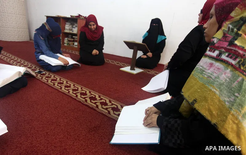 Palestinian blind girls read and memorise the holy Quran in braille at Dar al-Quran and Sunnah in Gaza city, on July 23, 2018. Photo by Mahmoud Ajour