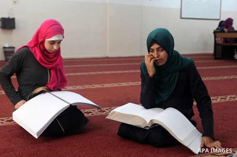 Palestinian blind girls read and memorise the holy Quran in braille at Dar al-Quran and Sunnah in Gaza city, on July 23, 2018. Photo by Mahmoud Ajour