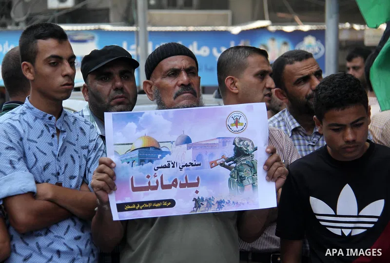 Palestinian supporters of Islamic Jihad movement take part during a protest to show solidarity with Al-Aqsa mosque, in Gaza city, on July 23, 2018. Photo by Mahmoud Ajour