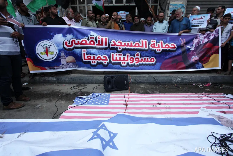 Palestinian supporters of Islamic Jihad movement take part during a protest to show solidarity with Al-Aqsa mosque, in Gaza city, on July 23, 2018. Photo by Mahmoud Ajour