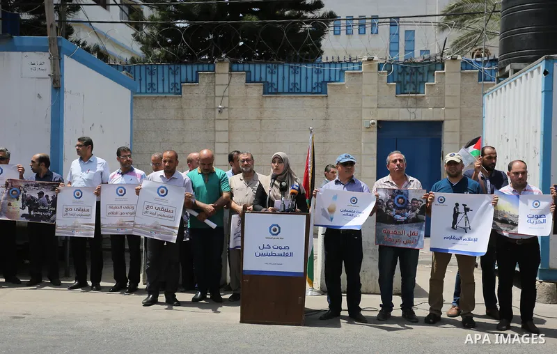 Palestinian journalists take part in a protest against the decision of the Israeli occupation to block work in Al-Quds TV in Jerusalem and West Bank, in front of the High Commissioner for Human Rights, in Gaza city on Ju...