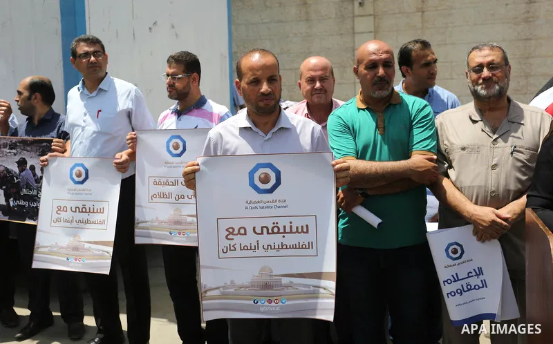 Palestinian journalists take part in a protest against the decision of the Israeli occupation to block work in Al-Quds TV in Jerusalem and West Bank, in front of the High Commissioner for Human Rights, in Gaza city on Ju...
