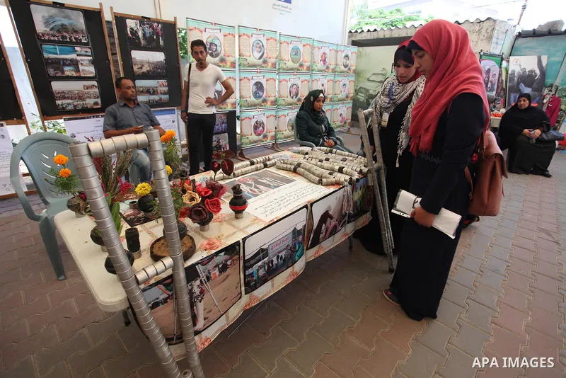 Palestinians attend an exhibition for the "Great Return March", in Gaza City on July 24, 2018. Photo by Mahmoud Ajour