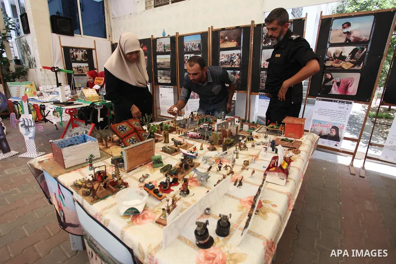 Palestinians attend an exhibition for the "Great Return March", in Gaza City on July 24, 2018. Photo by Mahmoud Ajour