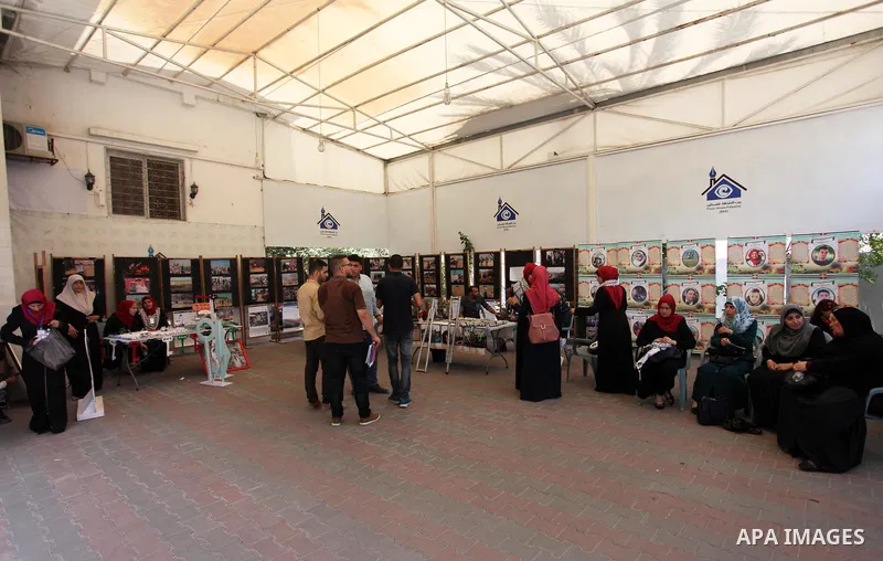 Palestinians attend an exhibition for the "Great Return March", in Gaza City on July 24, 2018. Photo by Mahmoud Ajour