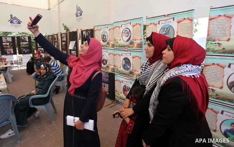 Palestinians attend an exhibition for the "Great Return March", in Gaza City on July 24, 2018. Photo by Mahmoud Ajour