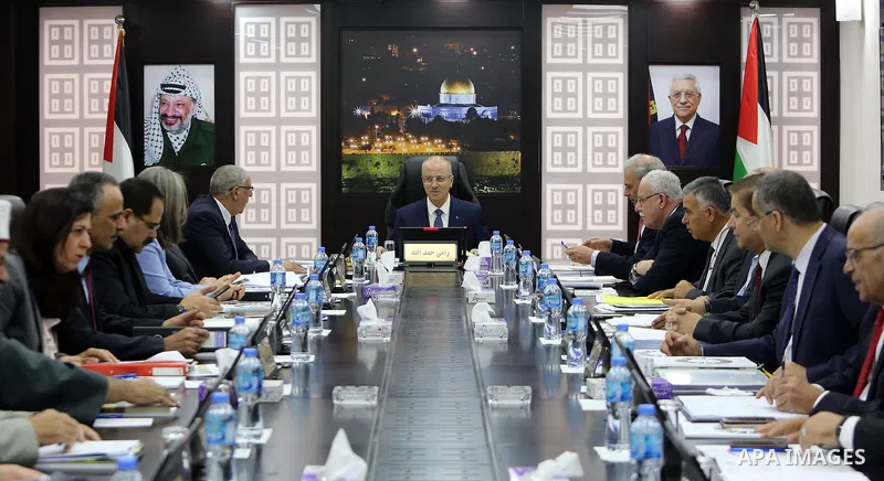 Palestinian Prime Minister Rami Hamdallah chairs a meeting with council of Ministers in the West Bank city of Ramallah on July 24, 2018. Photo by Prime Minister Office