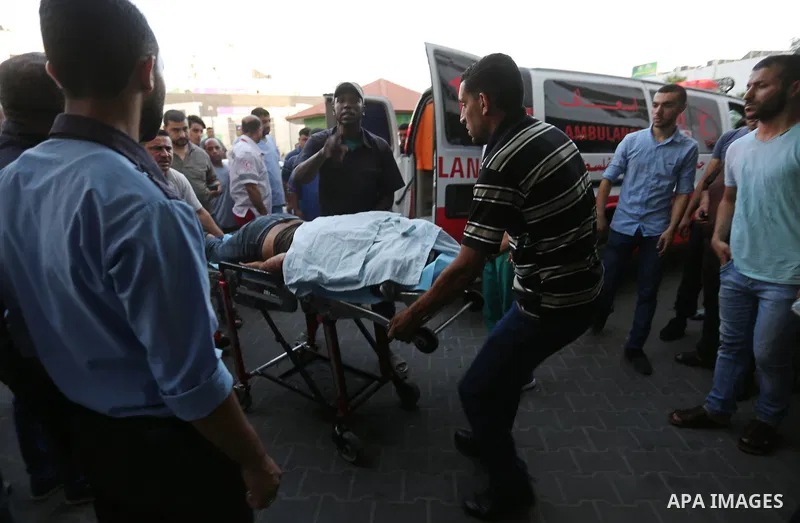 A Palestinian man who was wounded in an Israeli air strike, receives treatment at al-Shifa hospital in Gaza city on July 24, 2018. Photo by Ashraf Amra