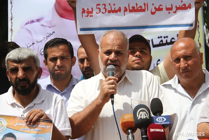 Palestinians take part in a protest to show solidarity with Hassan Shoka who is in hunger strike at Israeli jails, in Gaza city, on July 25, 2018. Photo by Mahmoud Ajour