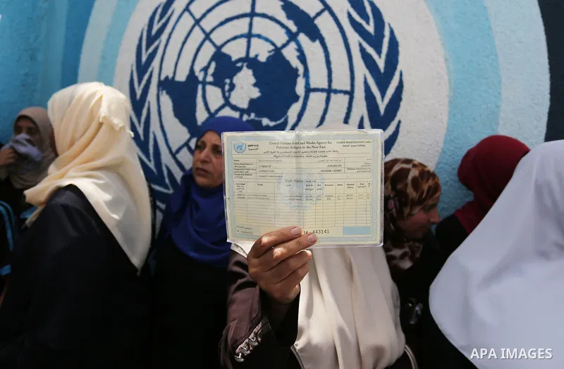 Palestinian employees of United Nations Relief and Works Agency (UNRWA) take part in a protest against jobs termination by UNRWA outside its headquarters in Gaza City, on July 25, 2018. Photo by Ashraf Amra