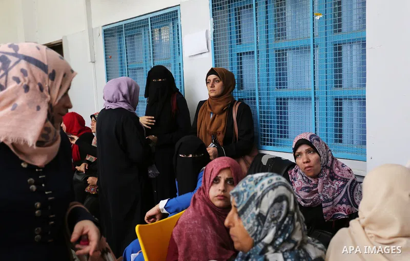 Palestinian employees of United Nations Relief and Works Agency (UNRWA) take part in a protest against jobs termination by UNRWA outside its headquarters in Gaza City, on July 25, 2018. Photo by Ashraf Amra