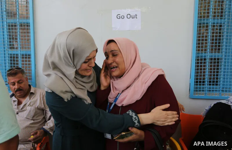 An employee of United Nations Relief and Works Agency (UNRWA) reacts during a protest against jobs termination by UNRWA inside its headquarters in Gaza City, on July 25, 2018. Photo by Ashraf Amra