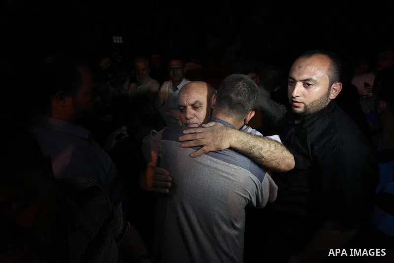 Palestinian relatives of Hamas members, who were killed by Israeli bombardment near the border with Israel, mourn outside al-shifa hospital in Gaza city on July 25, 2018. Photo by Mahmoud Ajour