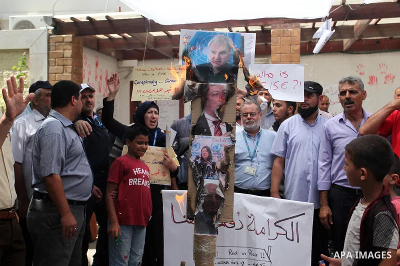 Palestinian employees of United Nations Relief and Works Agency (UNRWA) take part in a protest against jobs termination by UNRWA inside its headquarters in Gaza City, on July 26, 2018. Photo by Mahmoud Ajour