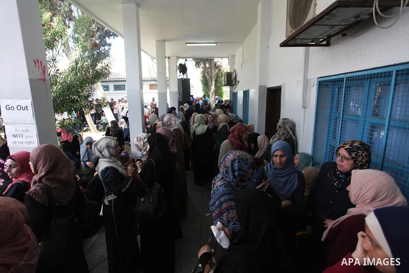 Palestinian employees of United Nations Relief and Works Agency (UNRWA) take part in a protest against jobs termination by UNRWA inside its headquarters in Gaza City, on July 26, 2018. Photo by Mahmoud Ajour